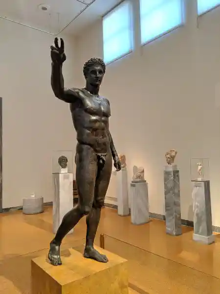 Bronze statue of nude youth in contrapposto stance, possibly Paris or Perseus, from Antikythera shipwreck